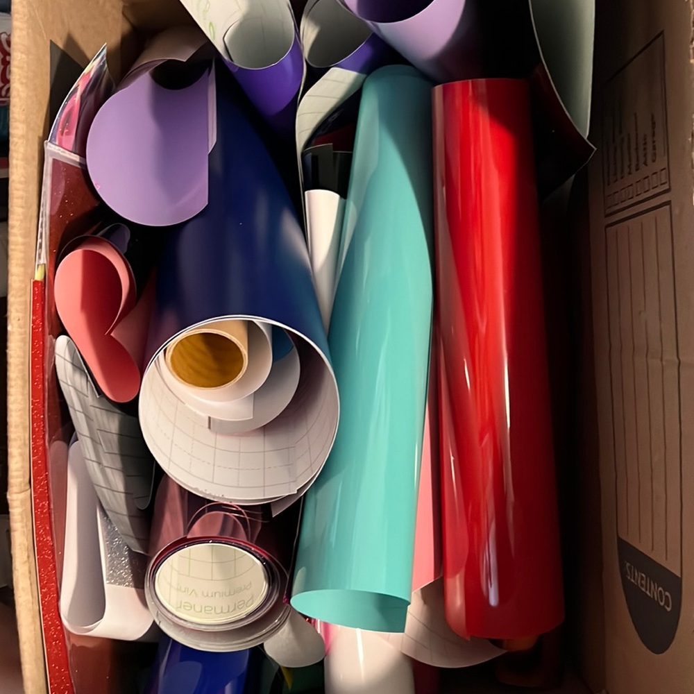 Box full of partially used vinyl for cricut machine